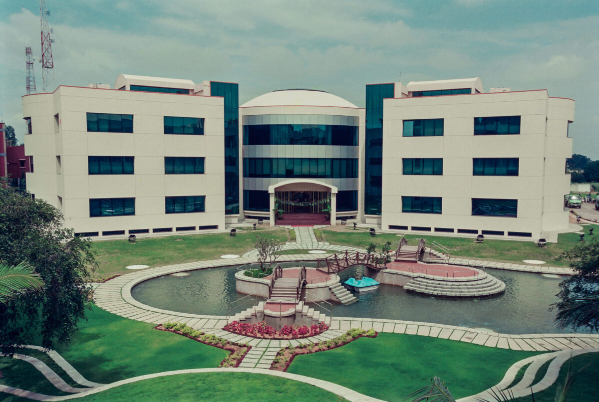 The pond to collect rain water overflow with the Management Development Center building